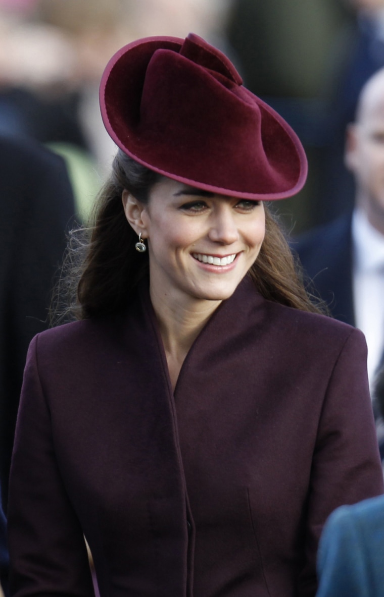 Image: Kate, Duchess of Cambridge, accompanied by other members of Britain's royal family, arrives to attend a Christmas Service at St. Mary's church